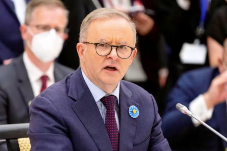 澳大利亞總理看到別人拉屎屁股癢